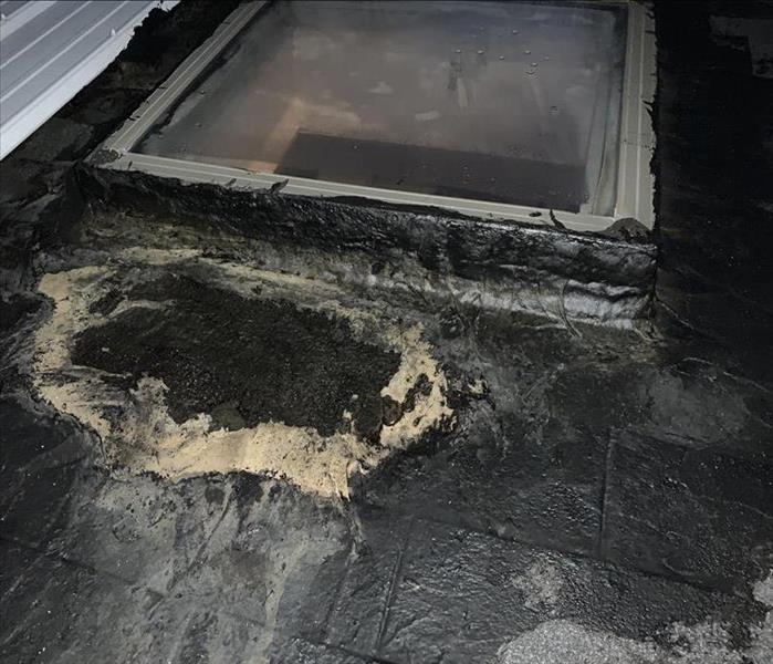 tar sealant degrading off of damaged roof
