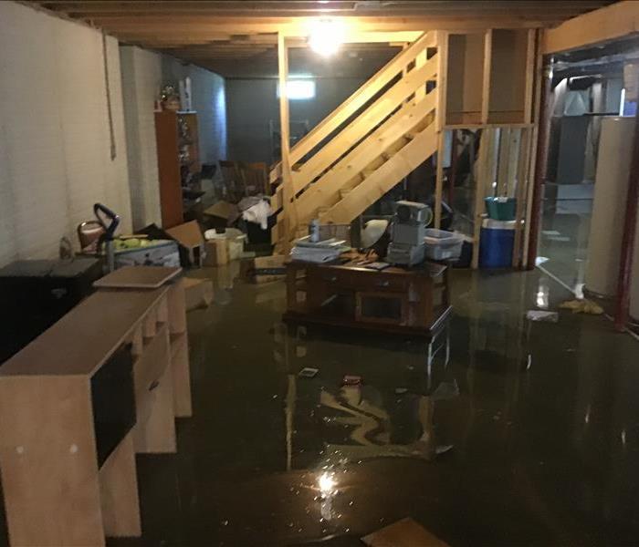 basement showing water covering the floor and contents floating